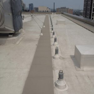 tie-back anchor system to protect workers from falls while working on or over roof edges
