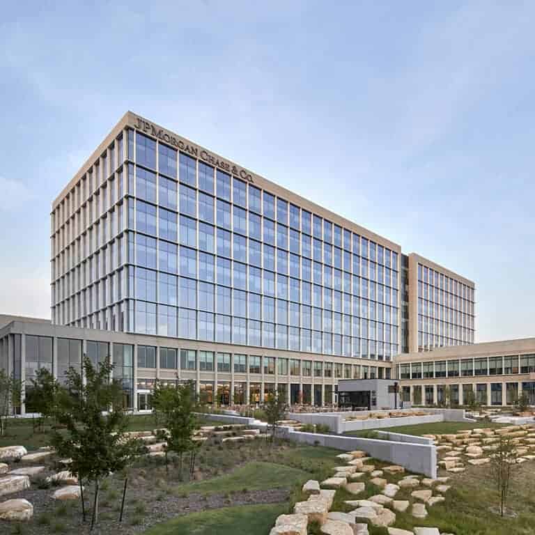 Building with large glass panels and cement structure in Texas