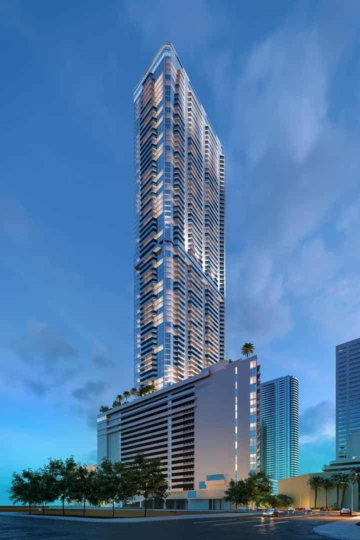 Miami high-rise with glass balconies equipped with roof anchors on the lower terrace and window washing davits at the top