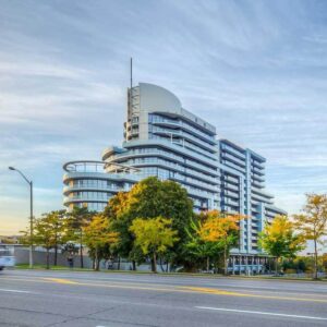 Mid-rise condominium surrounded by greenery