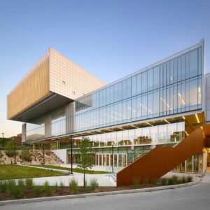 Exterior of a college building with a large glass hallway in Toronto, Ontario